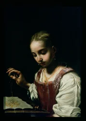 Una niña cosiendo